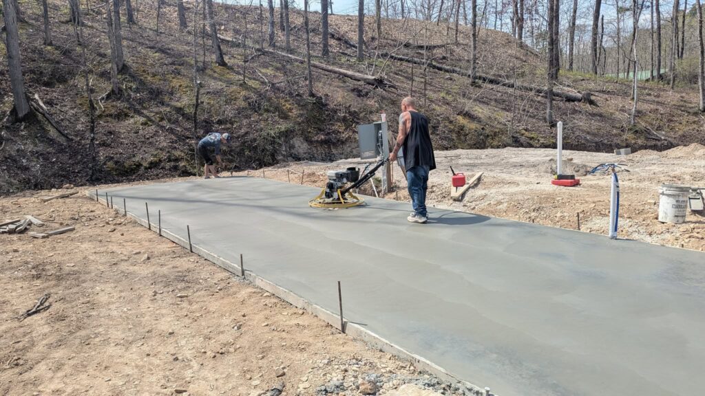 Heavy riprap rock erosion armor placement along lake shoreline